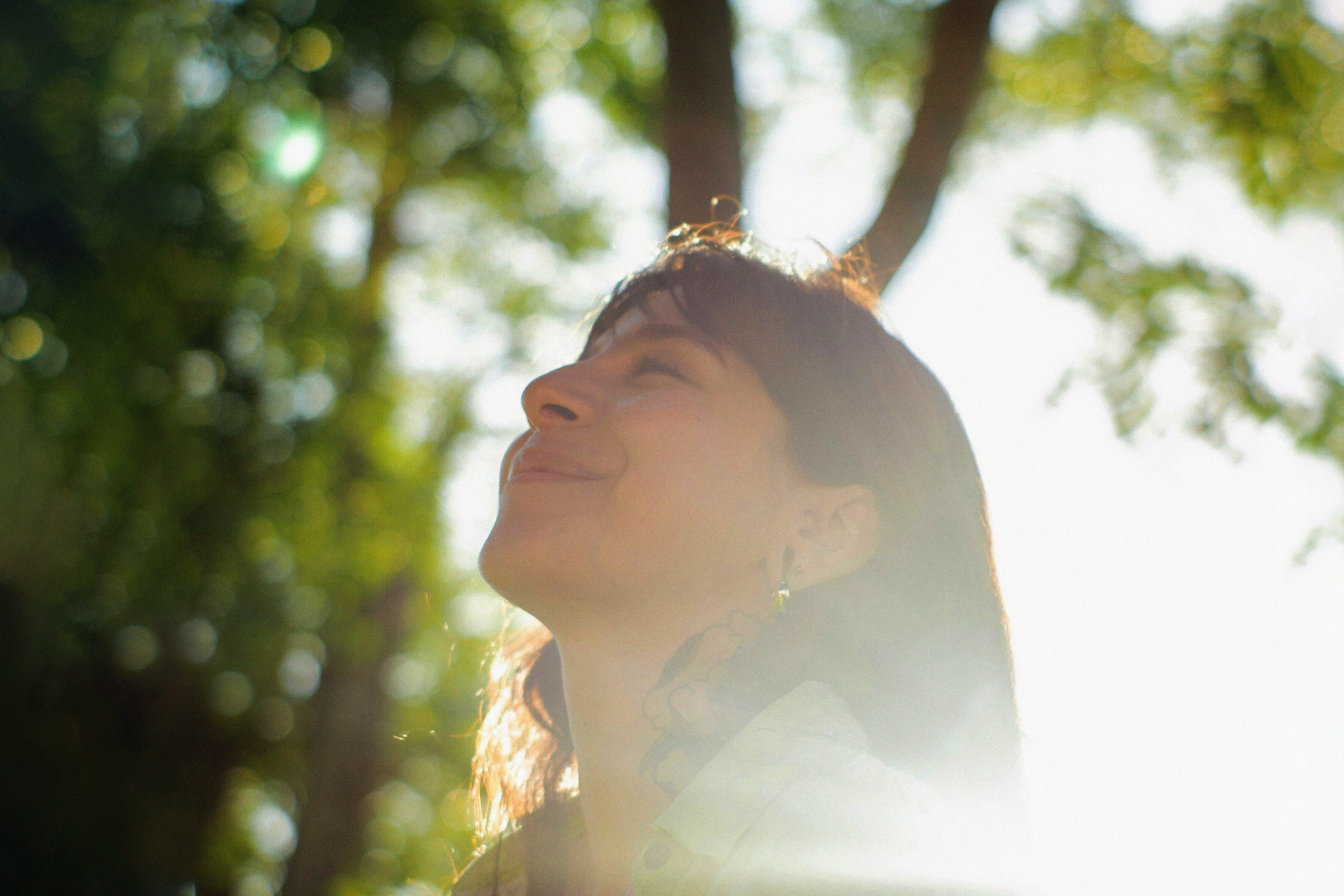 woman smiling into the sun