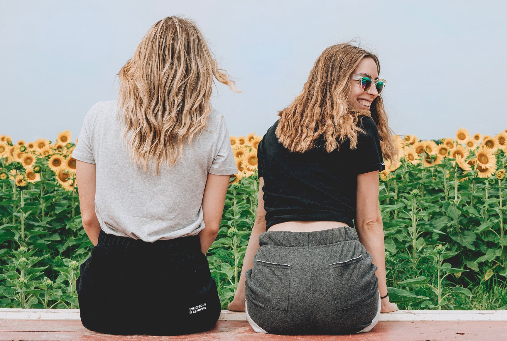 young women in sunflower field