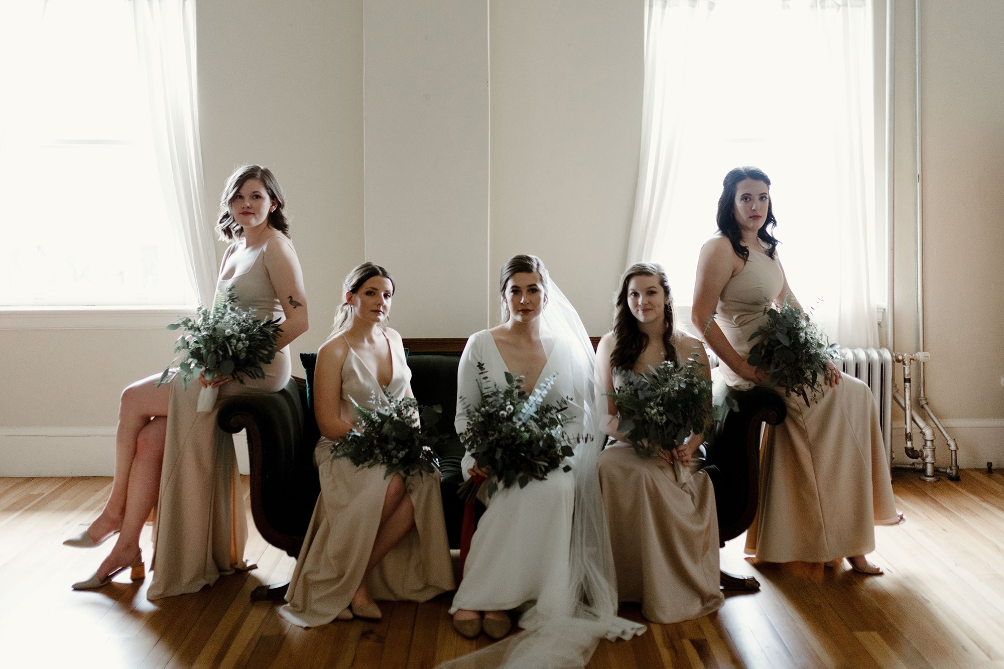 bride with bridal party in neutral minimal colors