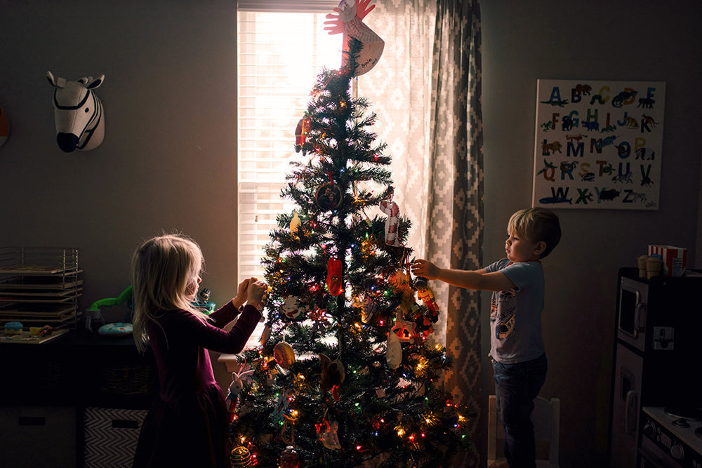 kids decorating christmas tree