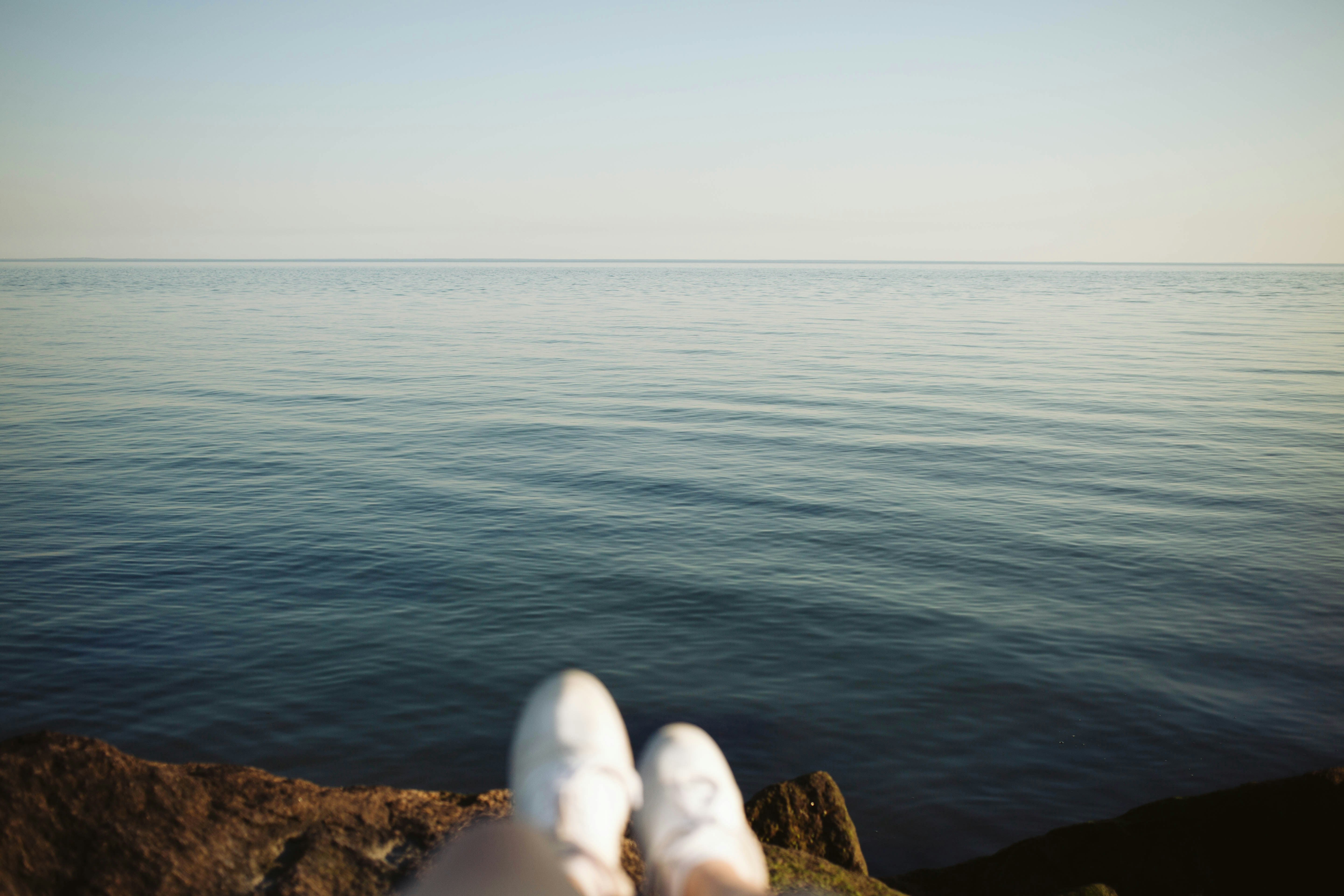 Person looking out onto the water