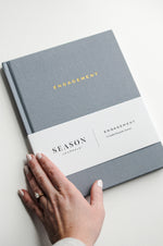 Load image into Gallery viewer, Hand holding Season Journals Engagement Journal