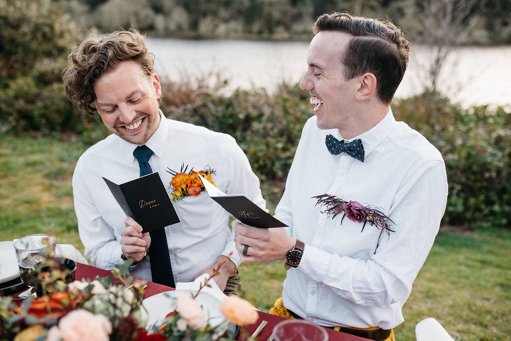 Couple reading wedding vows by Kai Hayashi Photo