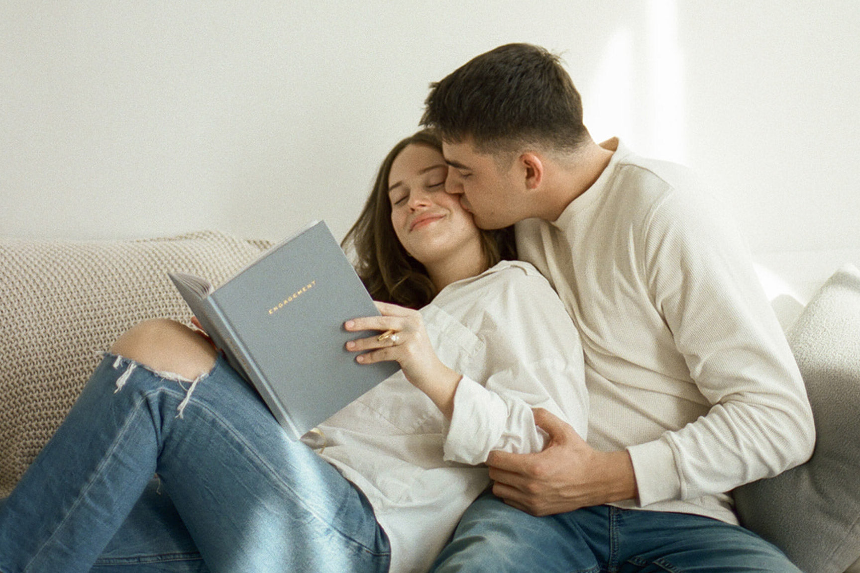 couple writing in the engagement journal