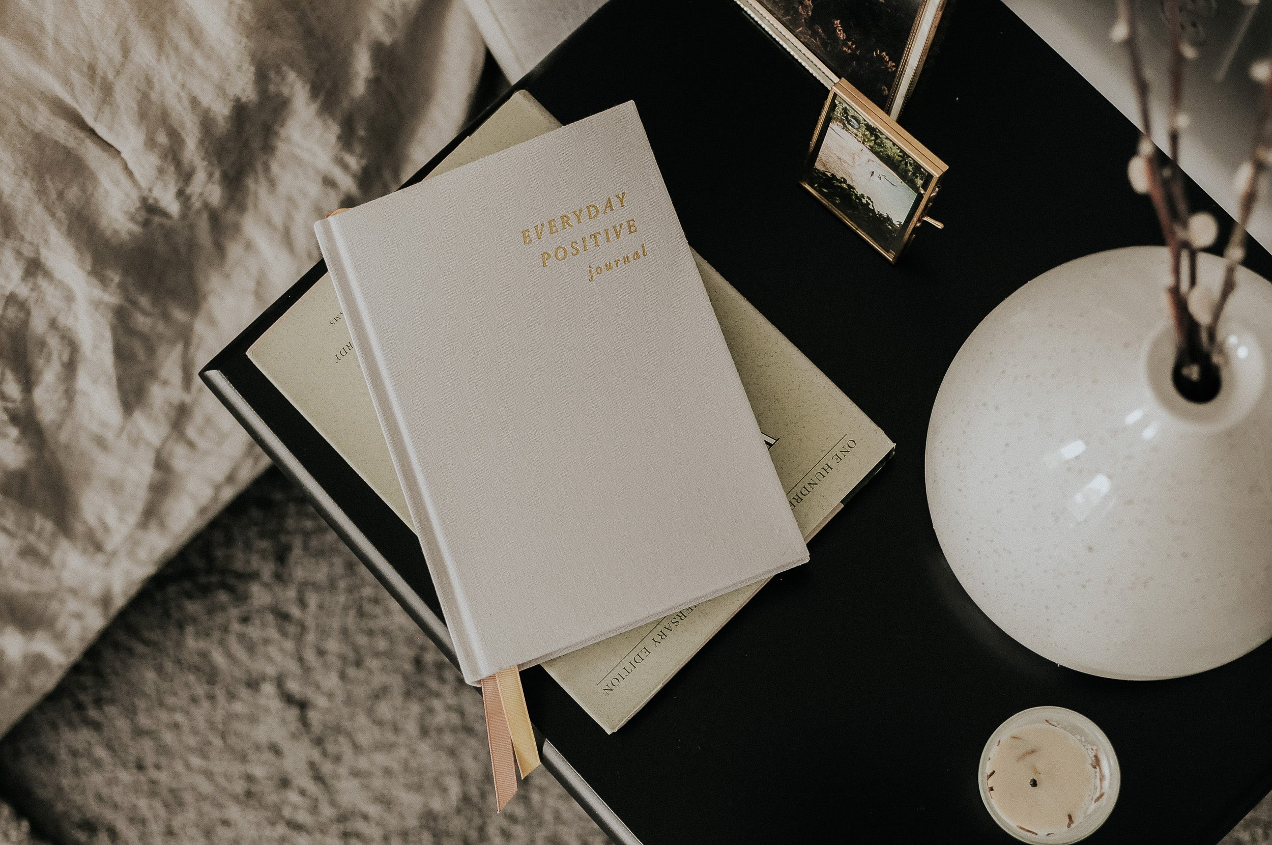 Everyday Positive Journal on nightstand