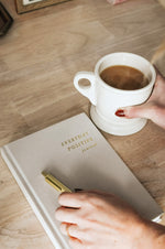 Load image into Gallery viewer, Everyday Positive Journal, gold pen, cup of coffee on desk
