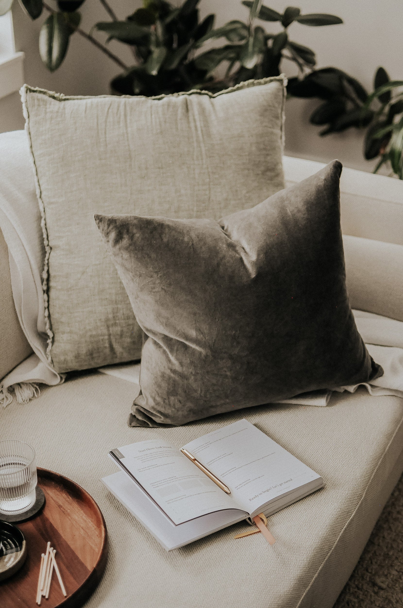 Everyday Positive Journal on cozy couch