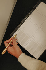 Load image into Gallery viewer, Woman writing on the Everyday Growth Weekly Planner
