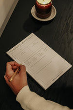 Load image into Gallery viewer, Woman writing on the Everyday Wellness Notepad
