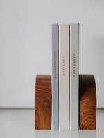 Load image into Gallery viewer, Three journals titled 'Engagement', 'Marriage', and 'Pregnancy' on wooden bookends against a plain background.
