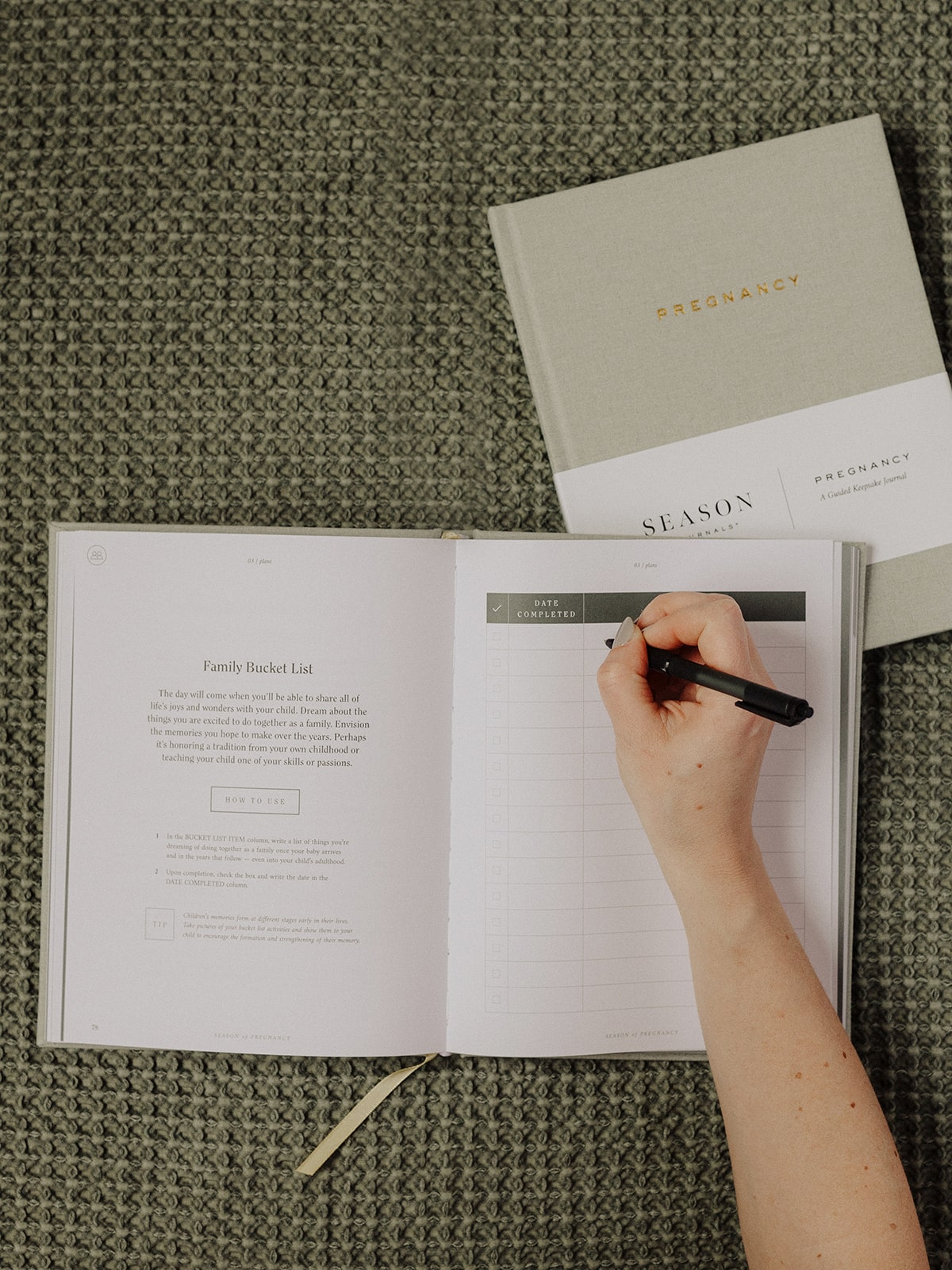 Mom-to-be writing in the Pregnancy Journal