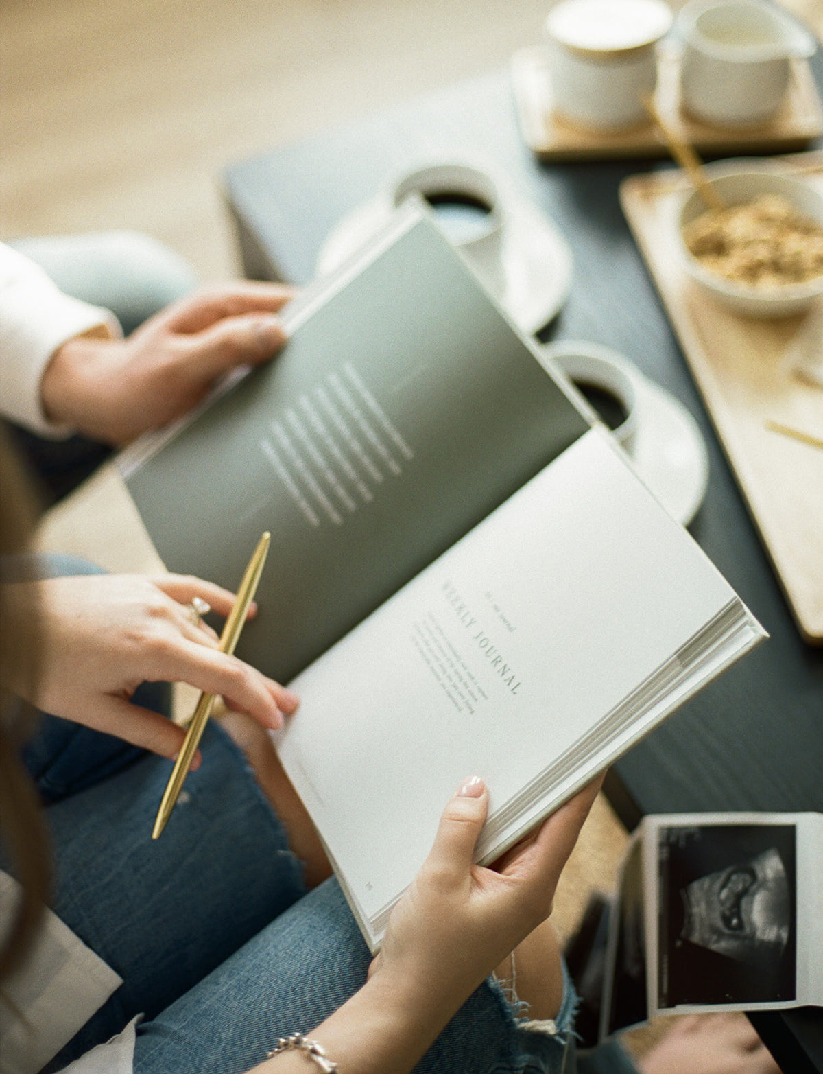 Couple journaling together in the Pregnancy Journal